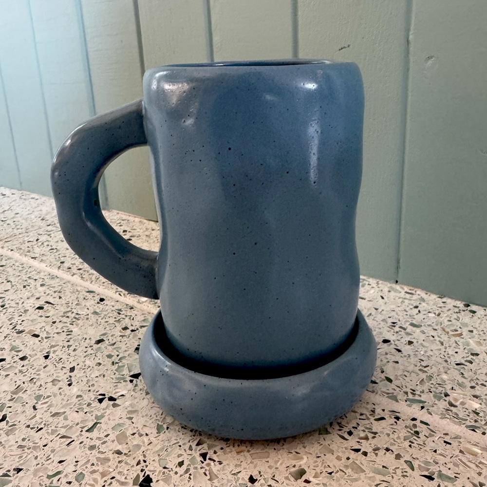 Tall ceramic mug with matching coaster